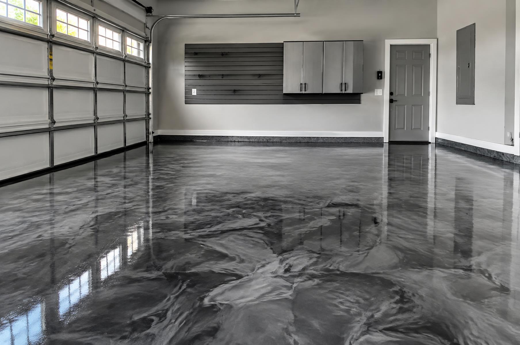 Metallic epoxy garage floor with silver and charcoal swirls in Lake City, FL