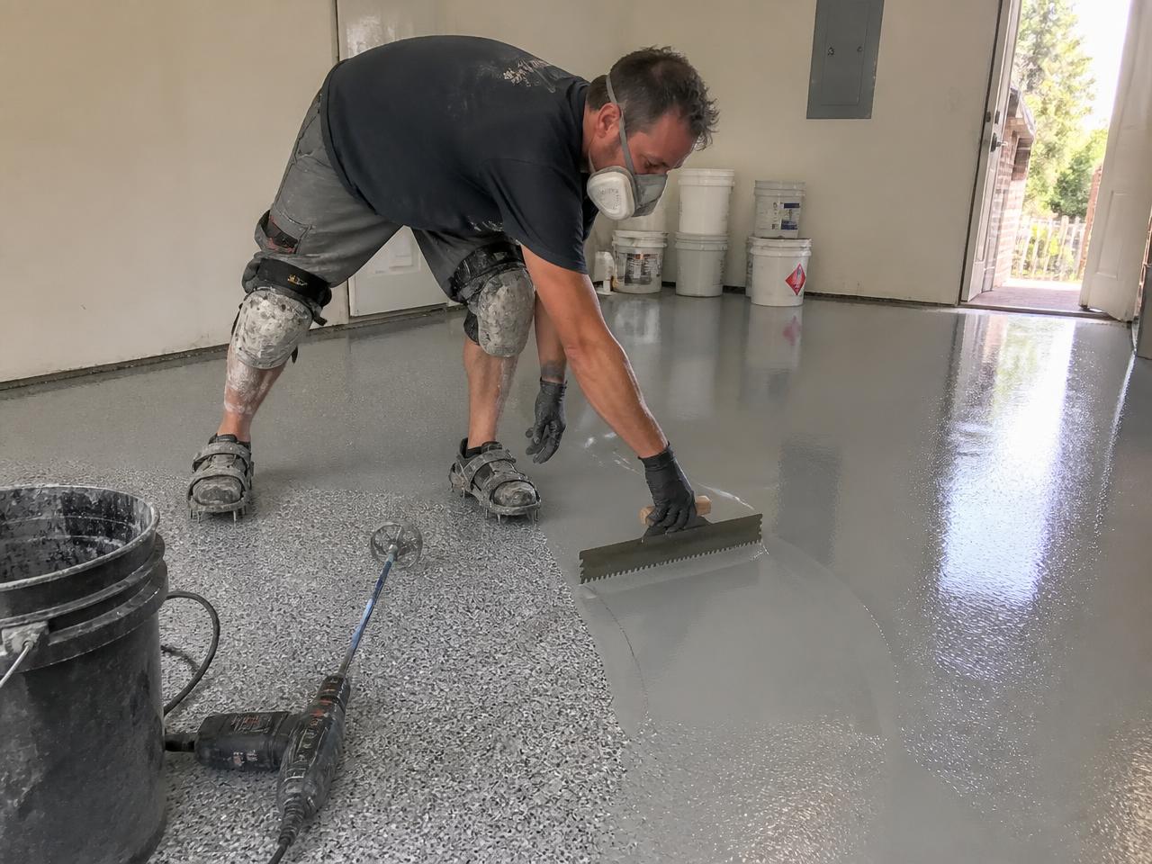 Creative Epoxy technician applying an epoxy floor coating